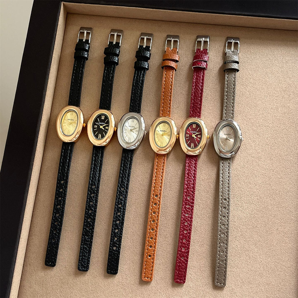 A lady with an oval-shaped small gold watch